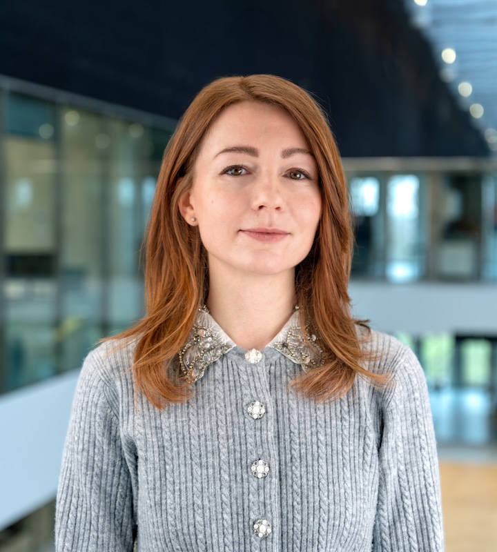 Picture of Valeria Korol with an out-of-focus
				    architectural background